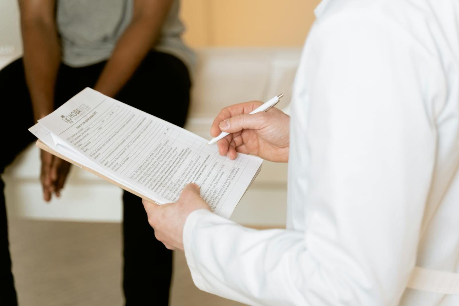 A doctor assessing a patient's injuries after a motor vehicle accident